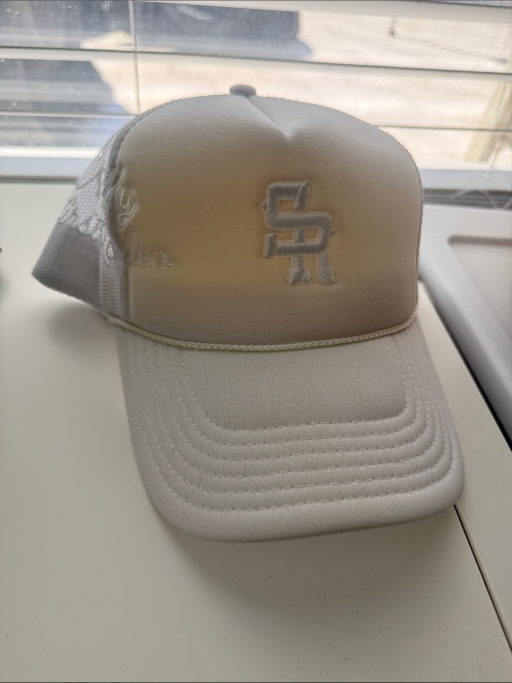 New Era White Mesh Trucker Cap with Raised Logo